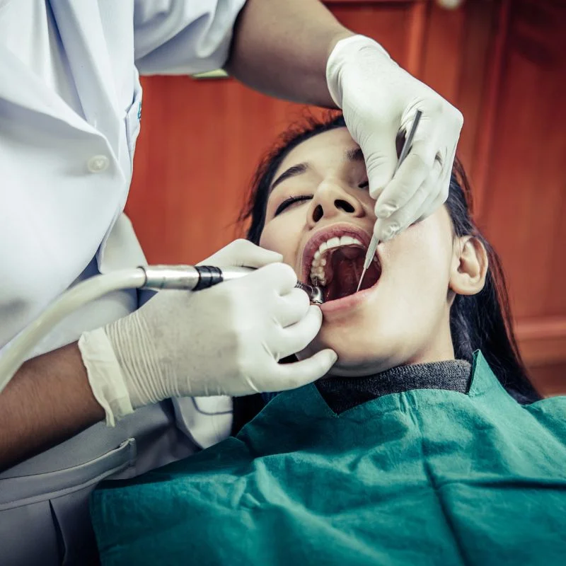Dentist performing root canal treatment on patient at Fairmont Dental Centre in London Ontario
