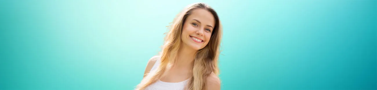 Cosmetic Dentistry at Fairmont Dental Centre Woman smiling with bright teeth after cosmetic dentistry treatment at Fairmont Dental Centre in London Ontario